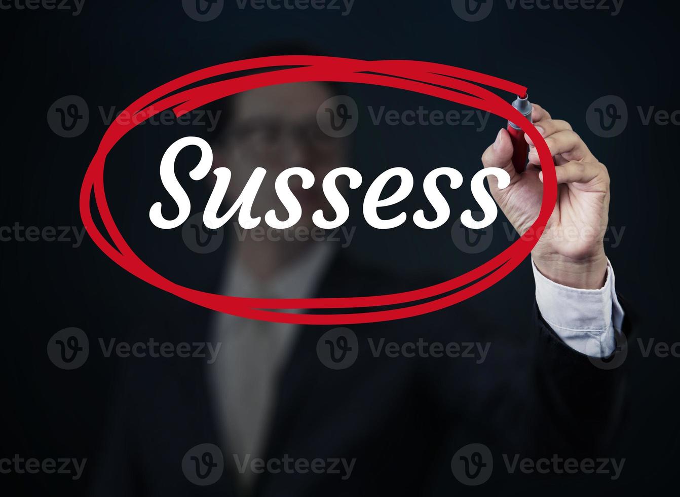Businessman hand writing Success with red marker on transparent board, new business concept, studio shot photo