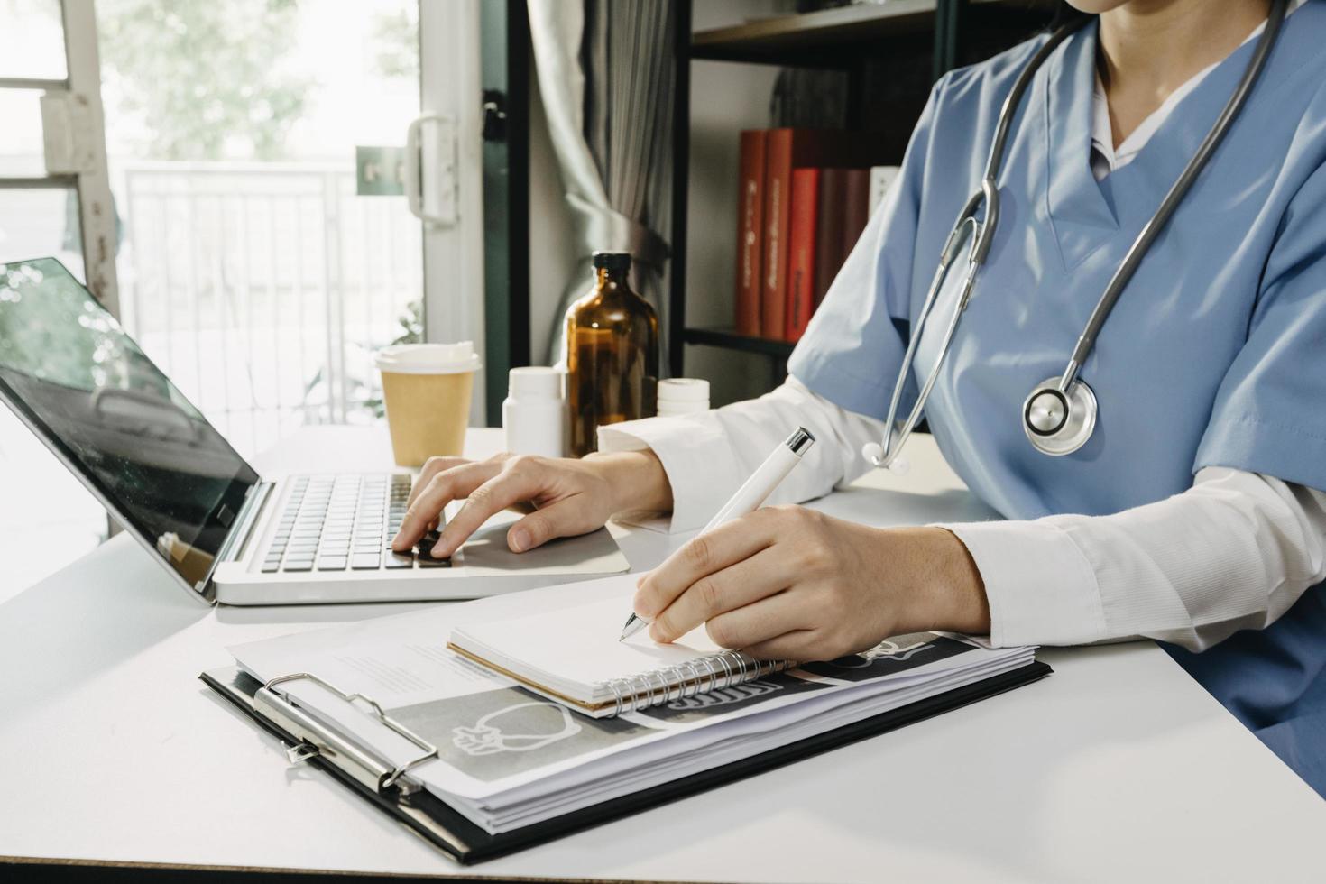 Medicine doctor and stethoscope touching icon medical network connection with modern interface on digital tablet in hospital background. Medical technology network concept photo
