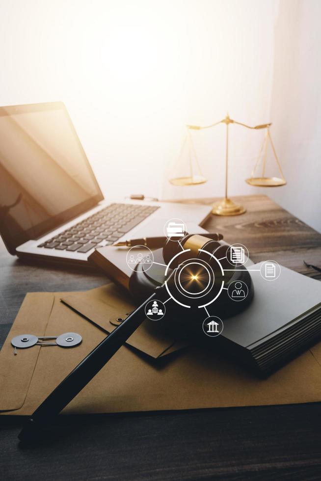 Business and lawyers discussing contract papers with brass scale on desk in office. Law, legal services, advice, justice and law concept picture with film grain effect photo