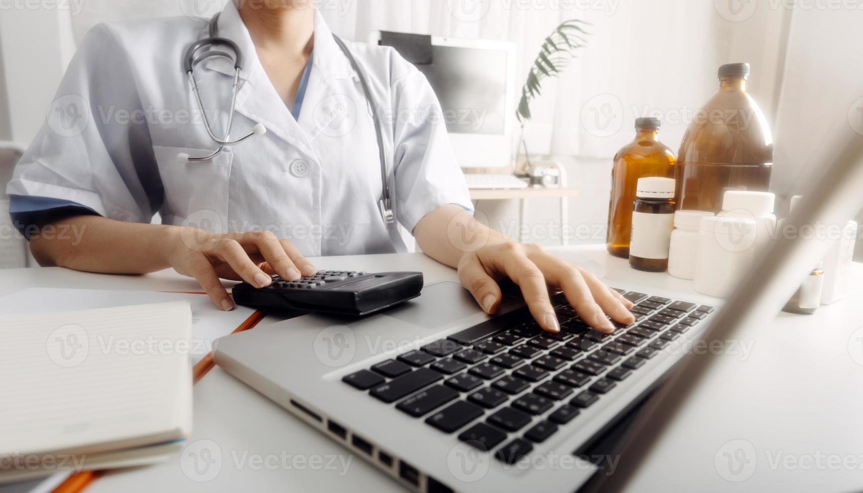 Medicine doctor and stethoscope touching icon medical network connection with modern interface on digital tablet in hospital background. Medical technology network concept photo