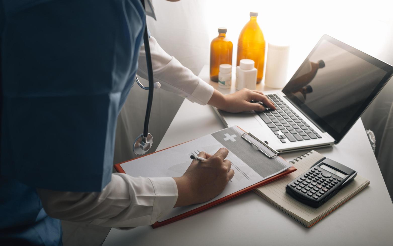 Medicine doctor and stethoscope touching icon medical network connection with modern interface on digital tablet in hospital background. Medical technology network concept photo