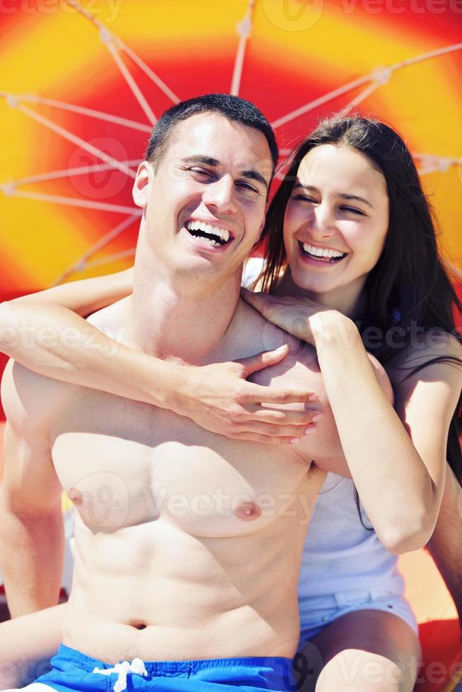 happy couple have fun on the beach photo