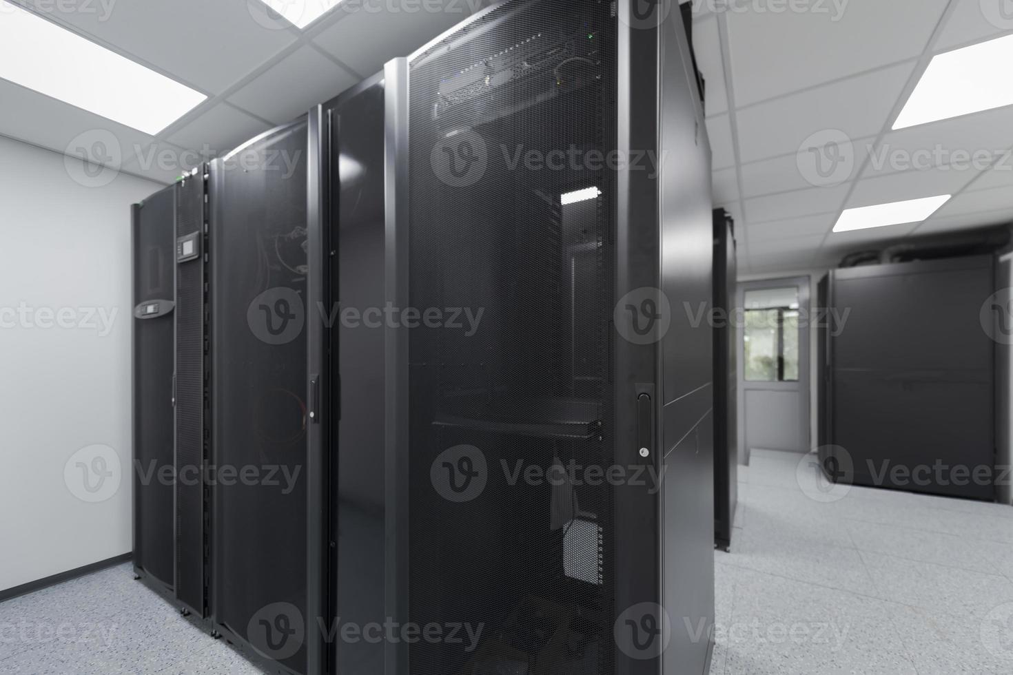 Data Center With Multiple Rows of Fully Operational Server Racks. Modern Telecommunications, Cloud Computing, Artificial Intelligence, Database, Supercomputer Technology Concept. photo