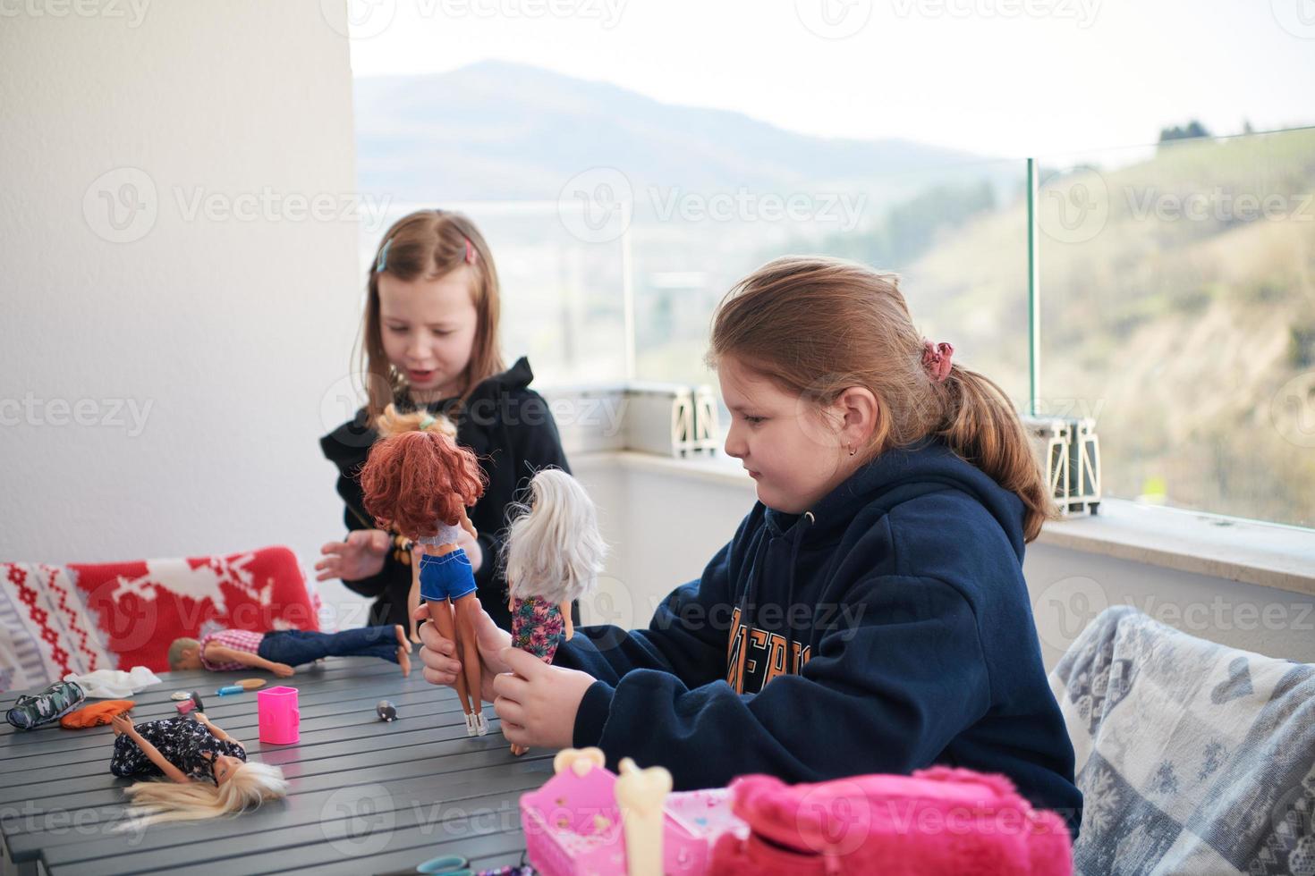 little girls playing with dolls photo