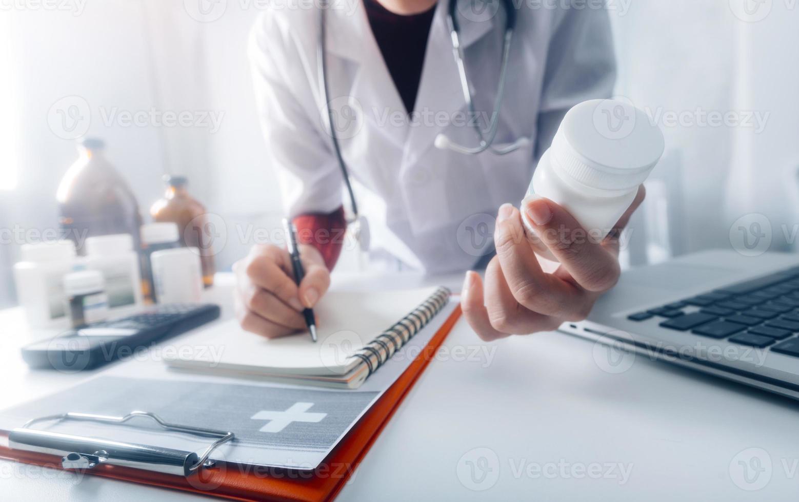Medicine doctor and stethoscope touching icon medical network connection with modern interface on digital tablet in hospital background. Medical technology network concept photo