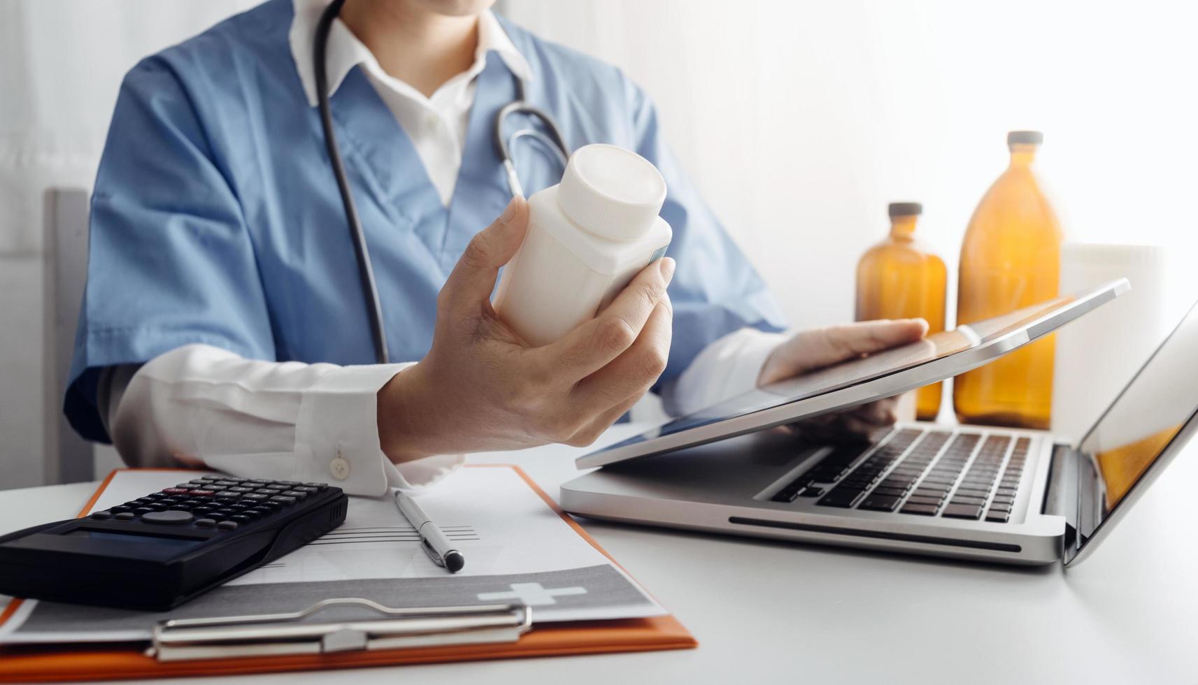 Medicine doctor and stethoscope touching icon medical network connection with modern interface on digital tablet in hospital background. Medical technology network concept photo