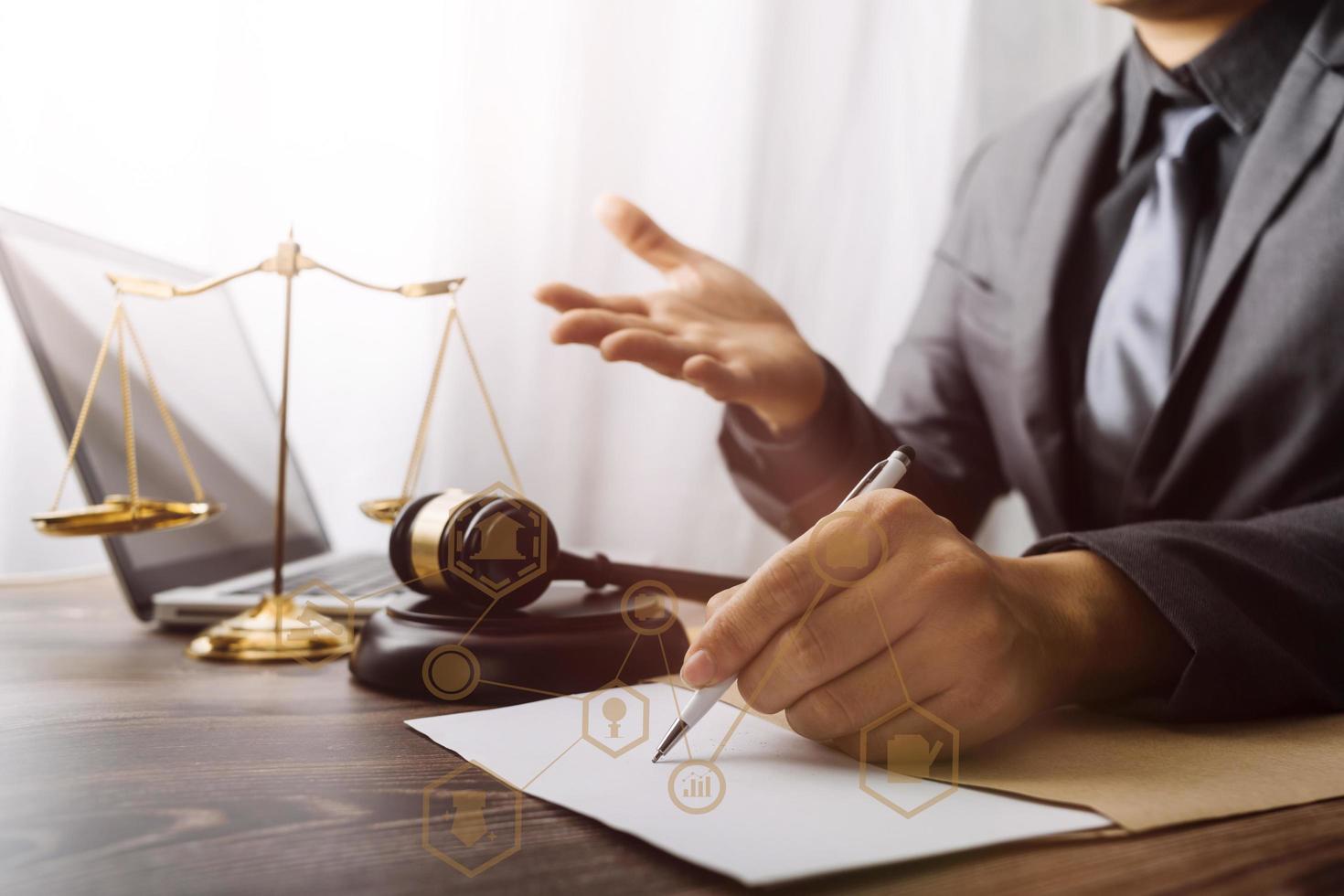 justice and law concept.Male judge in a courtroom on wooden table and Counselor or Male lawyer working in office. Legal law, advice and justice concept. photo