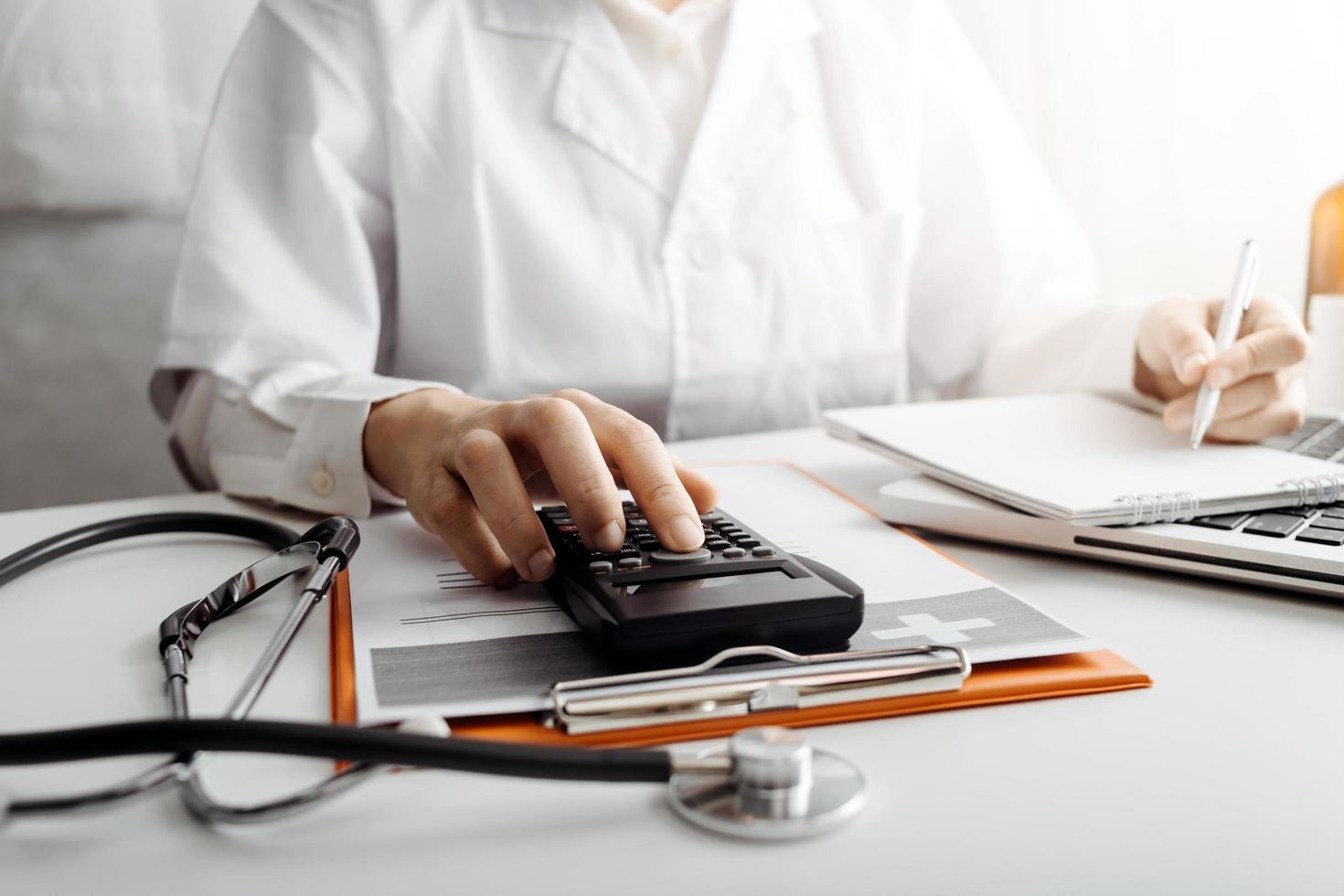 Medicine doctor and stethoscope touching icon medical network connection with modern interface on digital tablet in hospital background. Medical technology network concept photo