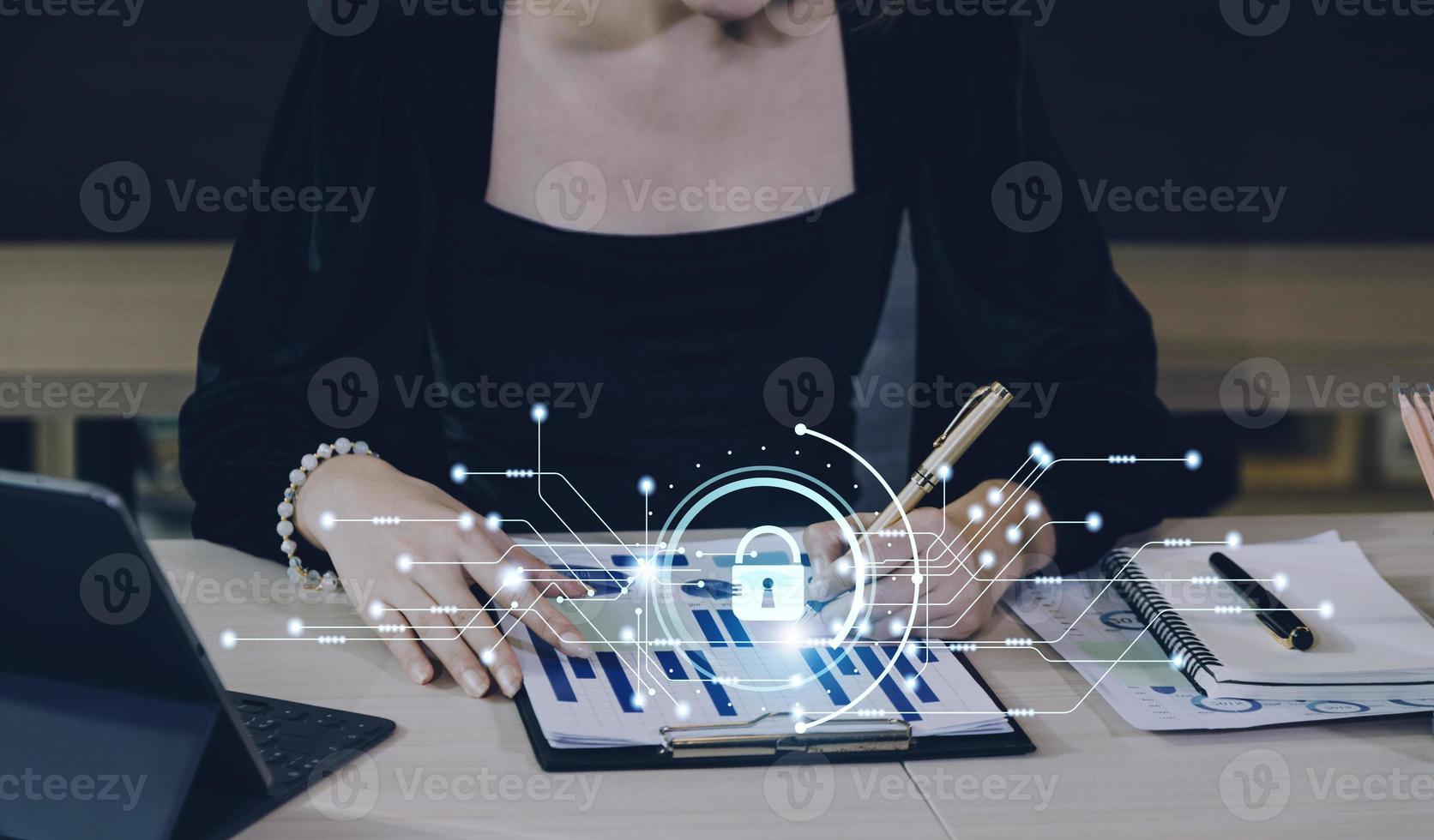 Cybersecurity and privacy concepts to protect data. Lock icon and internet network security technology. Businessman protecting personal data on smart phone with virtual screen interfaces. photo