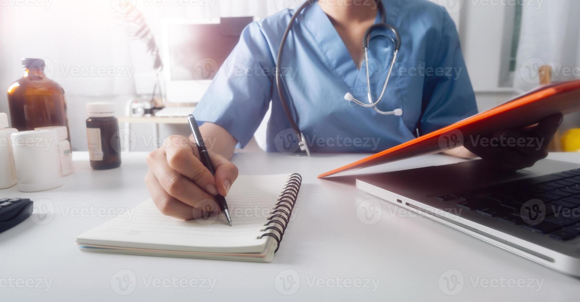 Medicine doctor and stethoscope touching icon medical network connection with modern interface on digital tablet in hospital background. Medical technology network concept photo