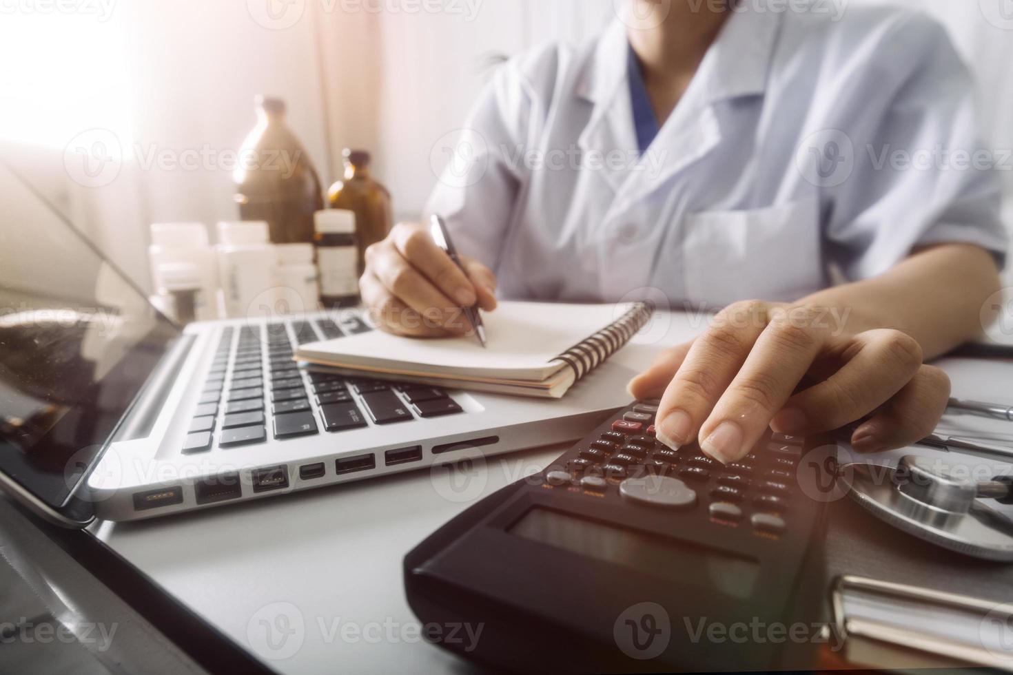 Medicine doctor and stethoscope touching icon medical network connection with modern interface on digital tablet in hospital background. Medical technology network concept photo