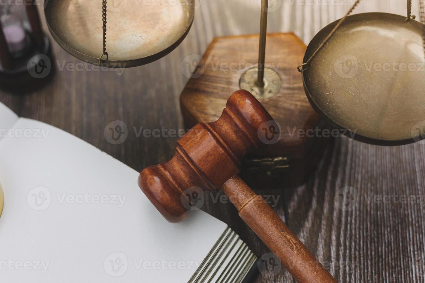 Business and lawyers discussing contract papers with brass scale on desk in office. Law, legal services, advice, justice and law concept picture with film grain effect photo