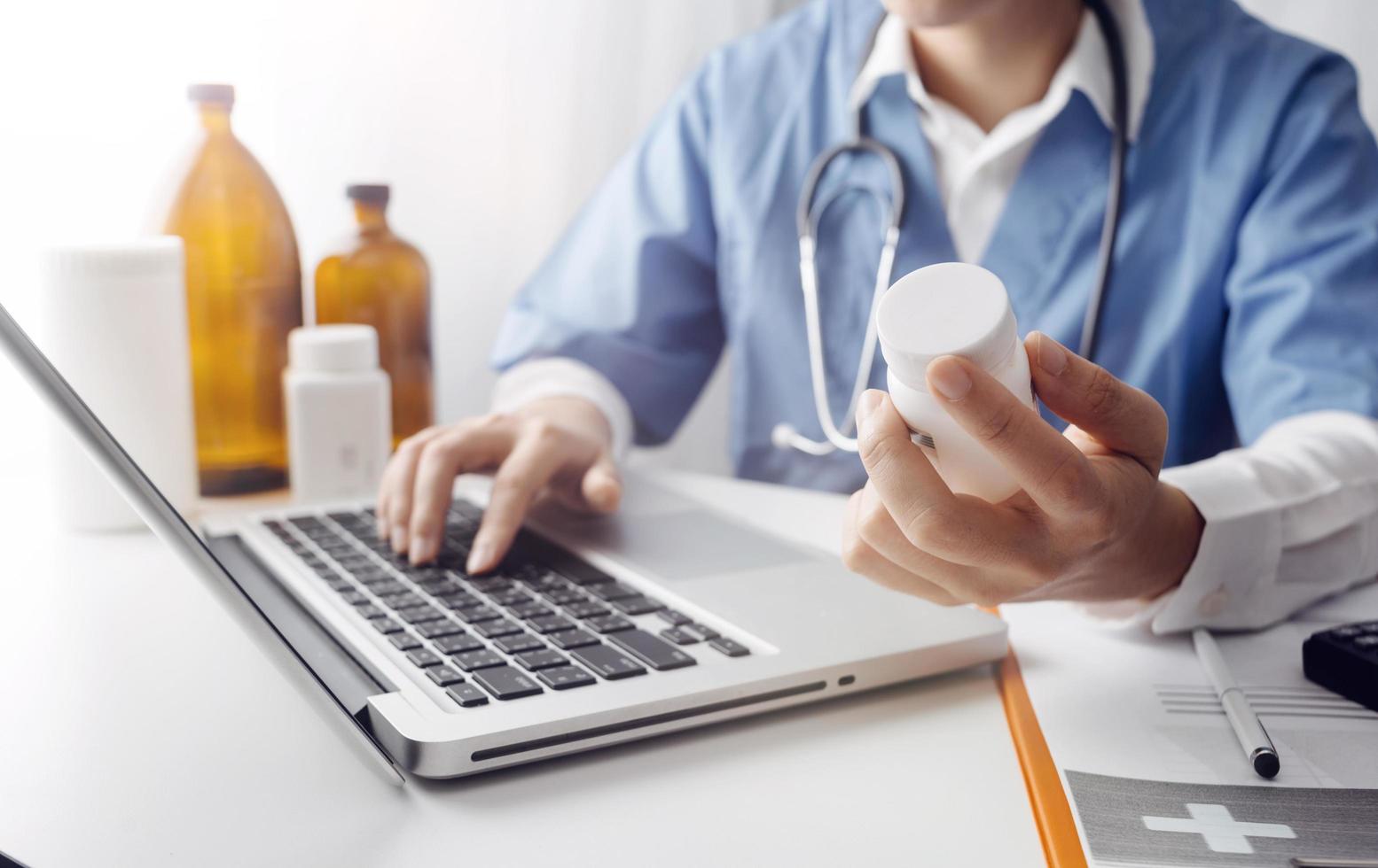 Medicine doctor and stethoscope touching icon medical network connection with modern interface on digital tablet in hospital background. Medical technology network concept photo