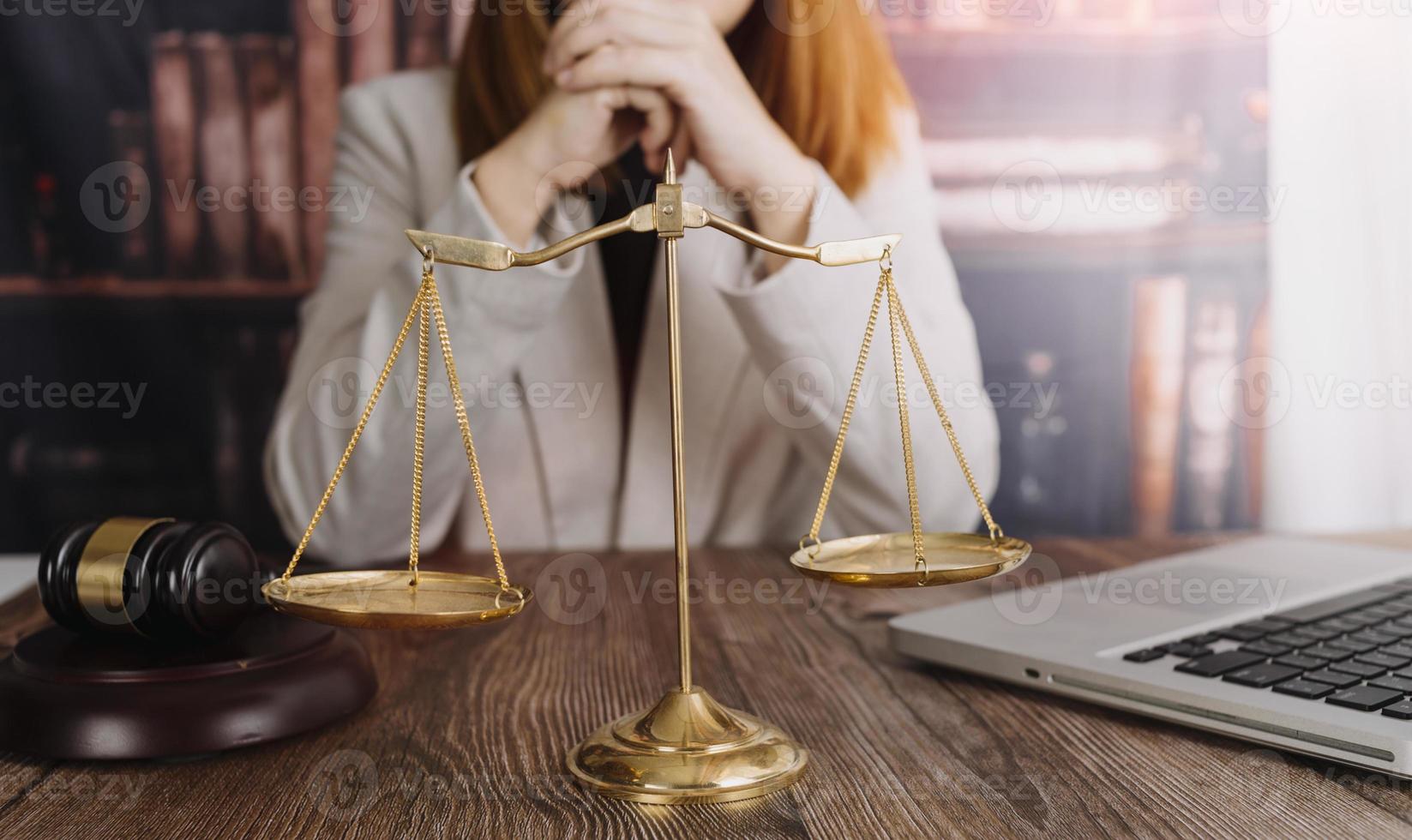 Business and lawyers discussing contract papers with brass scale on desk in office. Law, legal services, advice, justice and law concept picture with film grain effect photo