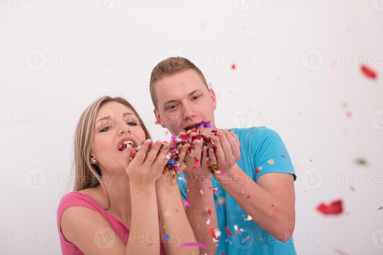romantic young  couple celebrating  party with confetti photo