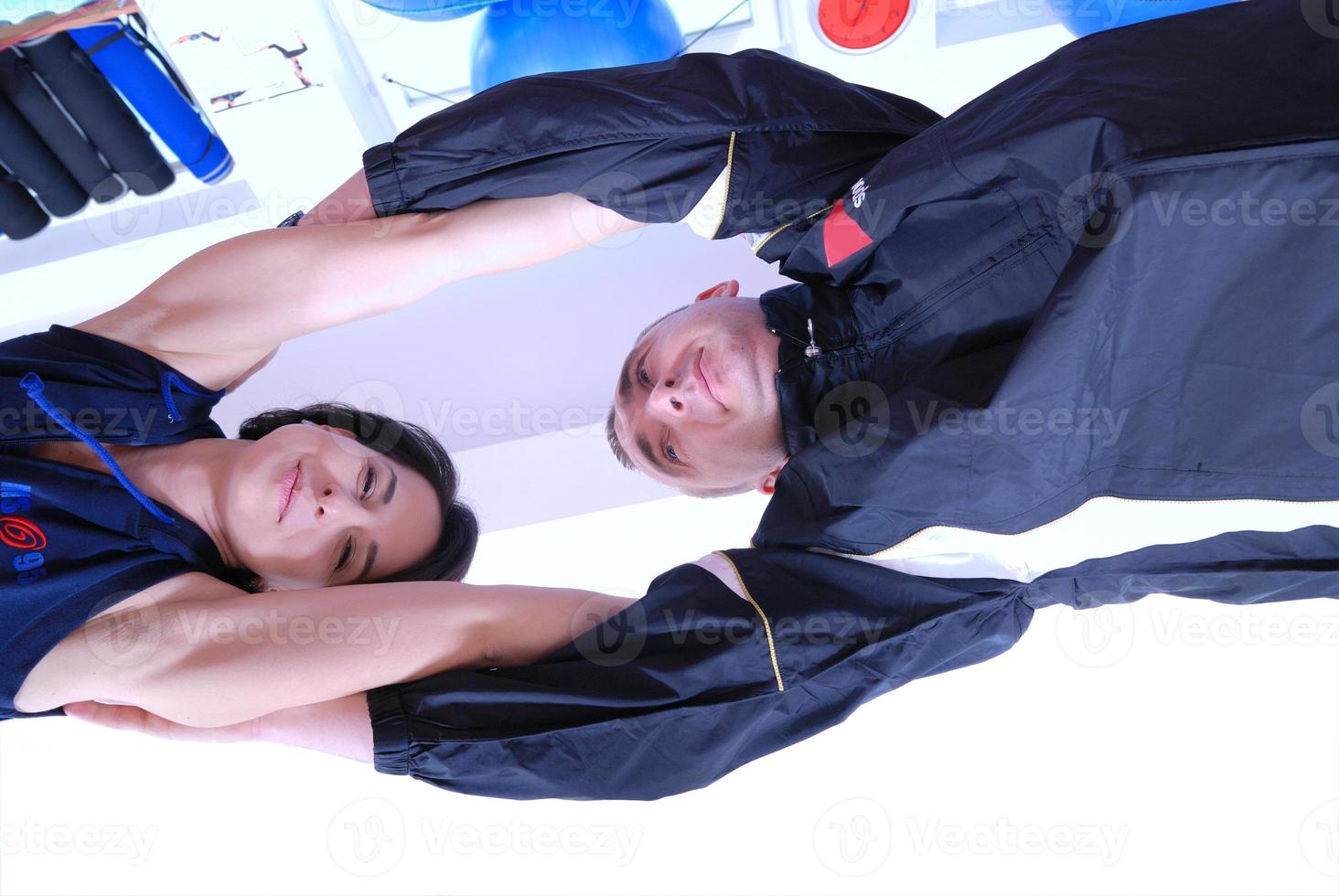 .happy couple recreating in fitness studio photo