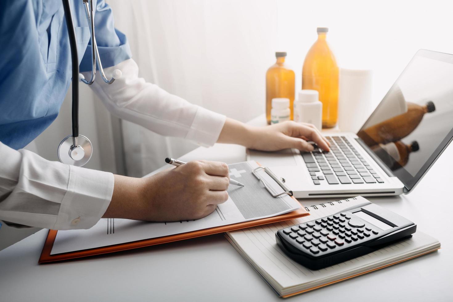 Medicine doctor and stethoscope touching icon medical network connection with modern interface on digital tablet in hospital background. Medical technology network concept photo