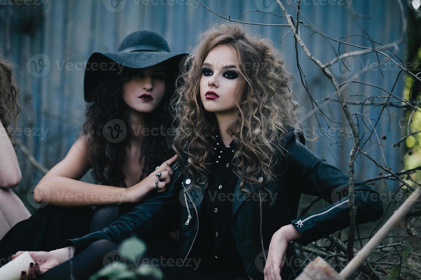 Two vintage witches gathered eve of Halloween photo