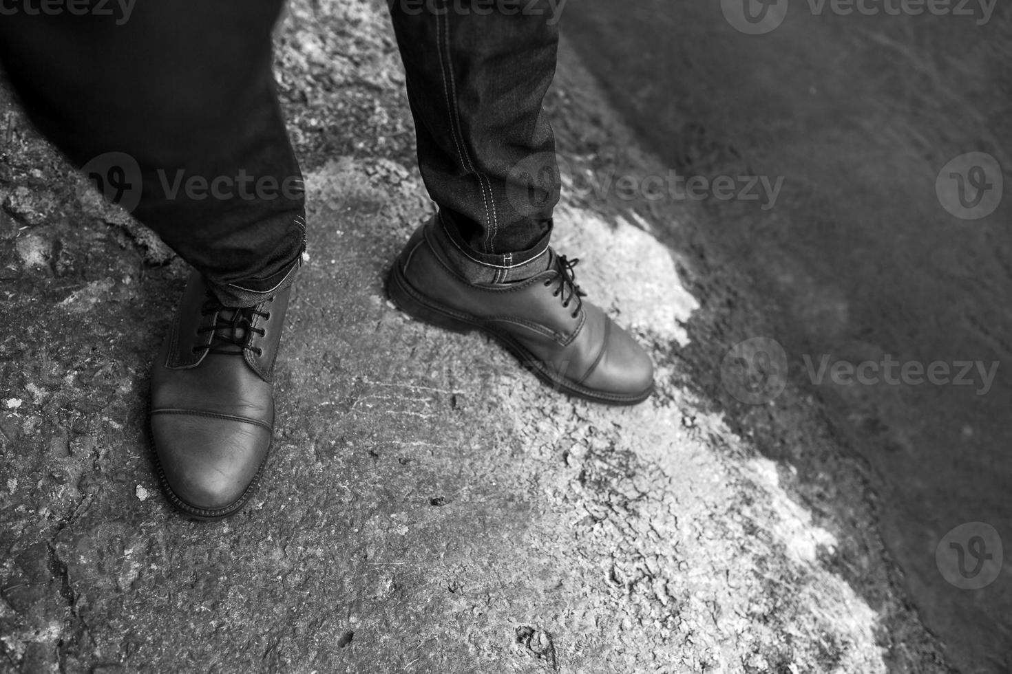 Feet of Men  in selvedge jeans and retro shoes photo