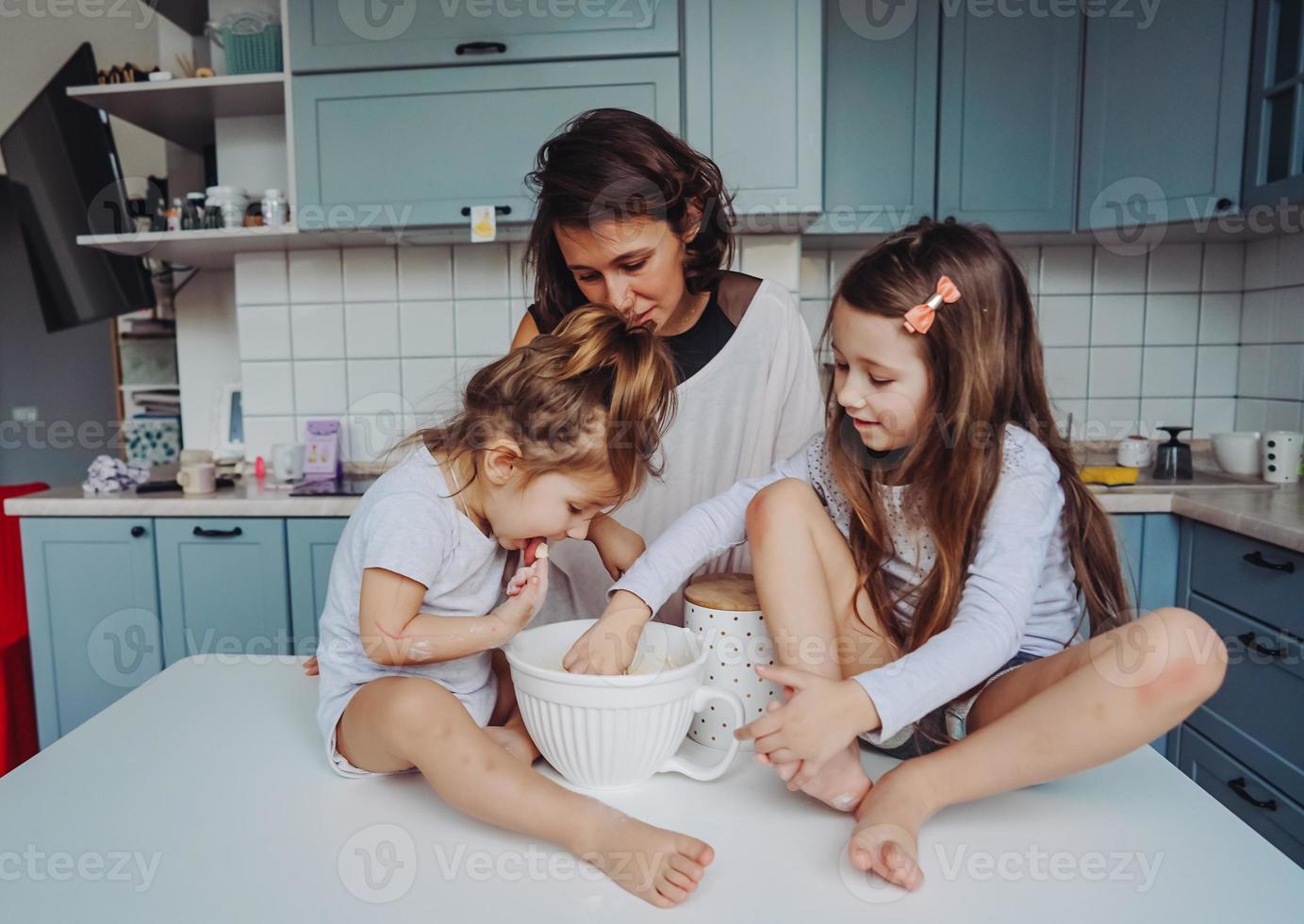 Happy family cook together in the kitchen photo