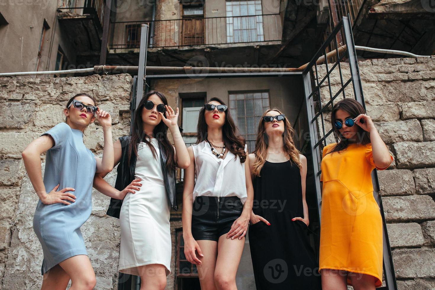 Five young beautiful girls in the city photo