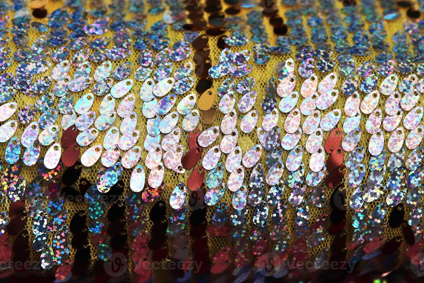 Detailed close up view on samples of cloth and fabrics in different colors found at a fabrics market photo