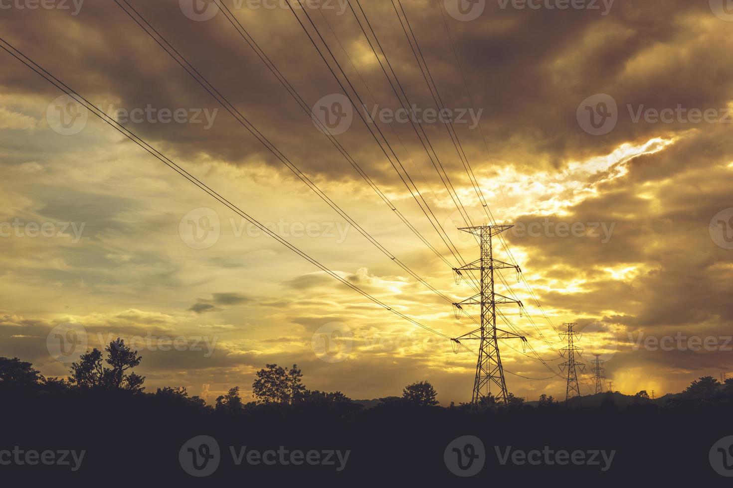 Electric power line with colorful sky at sunset - Vibrant color effect photo