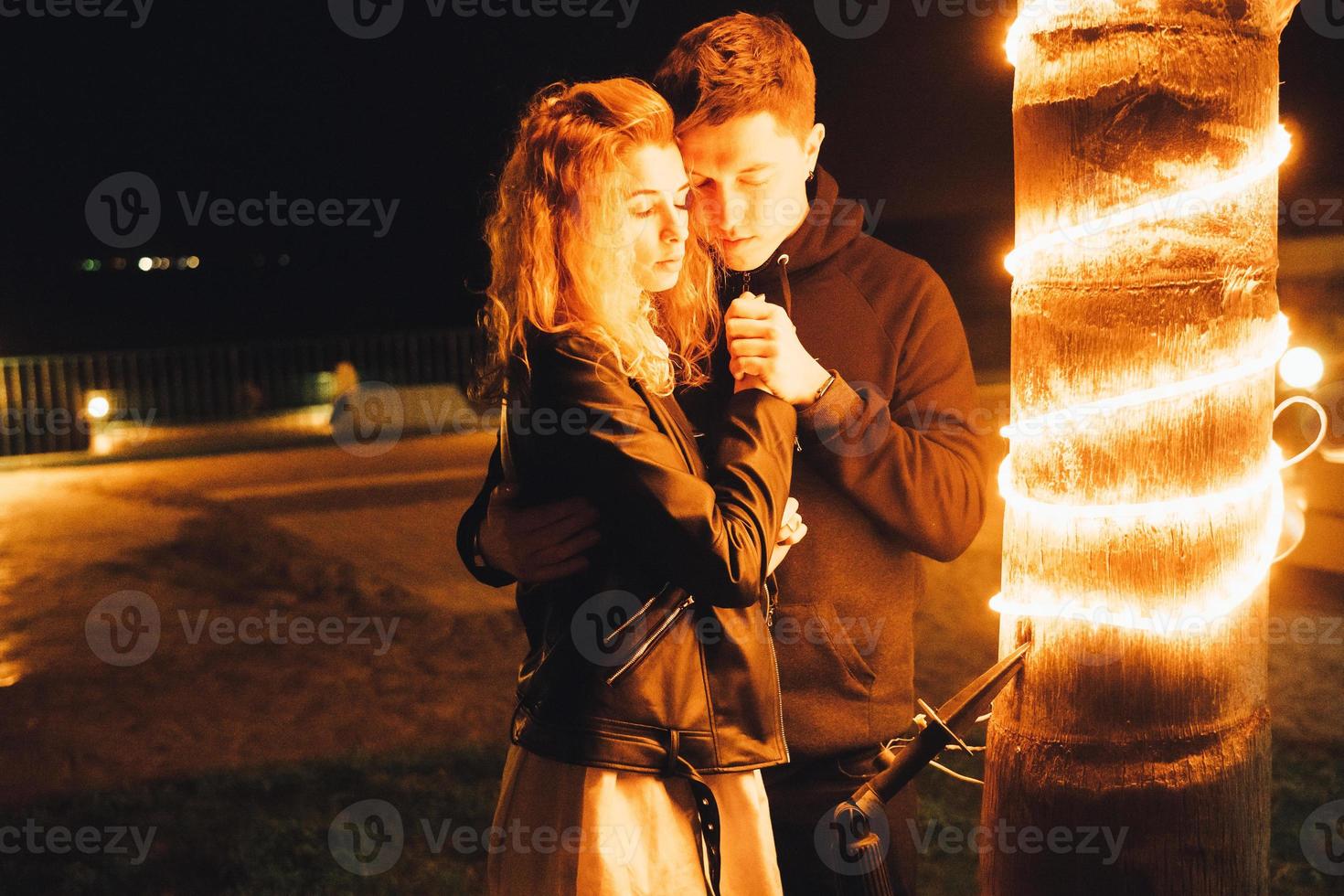 Young couple embracing outdoor photo