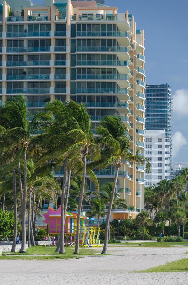 Colorful lifeguard towers and highrises in South Beach, Miami. photo