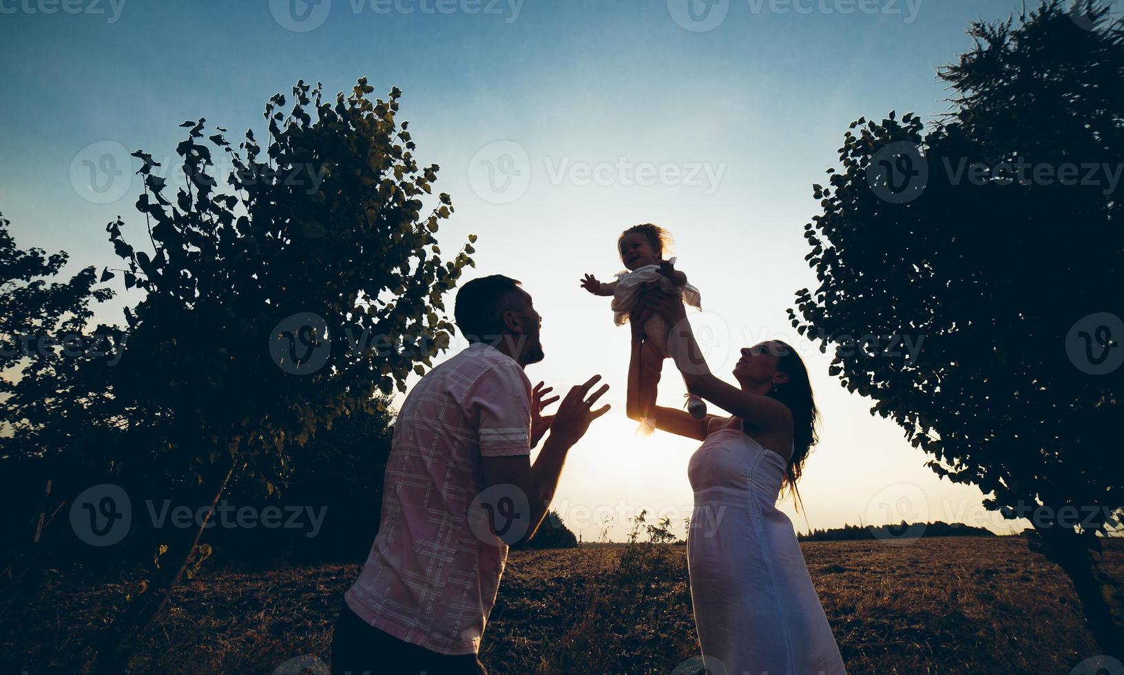 Parents and kid spending time photo