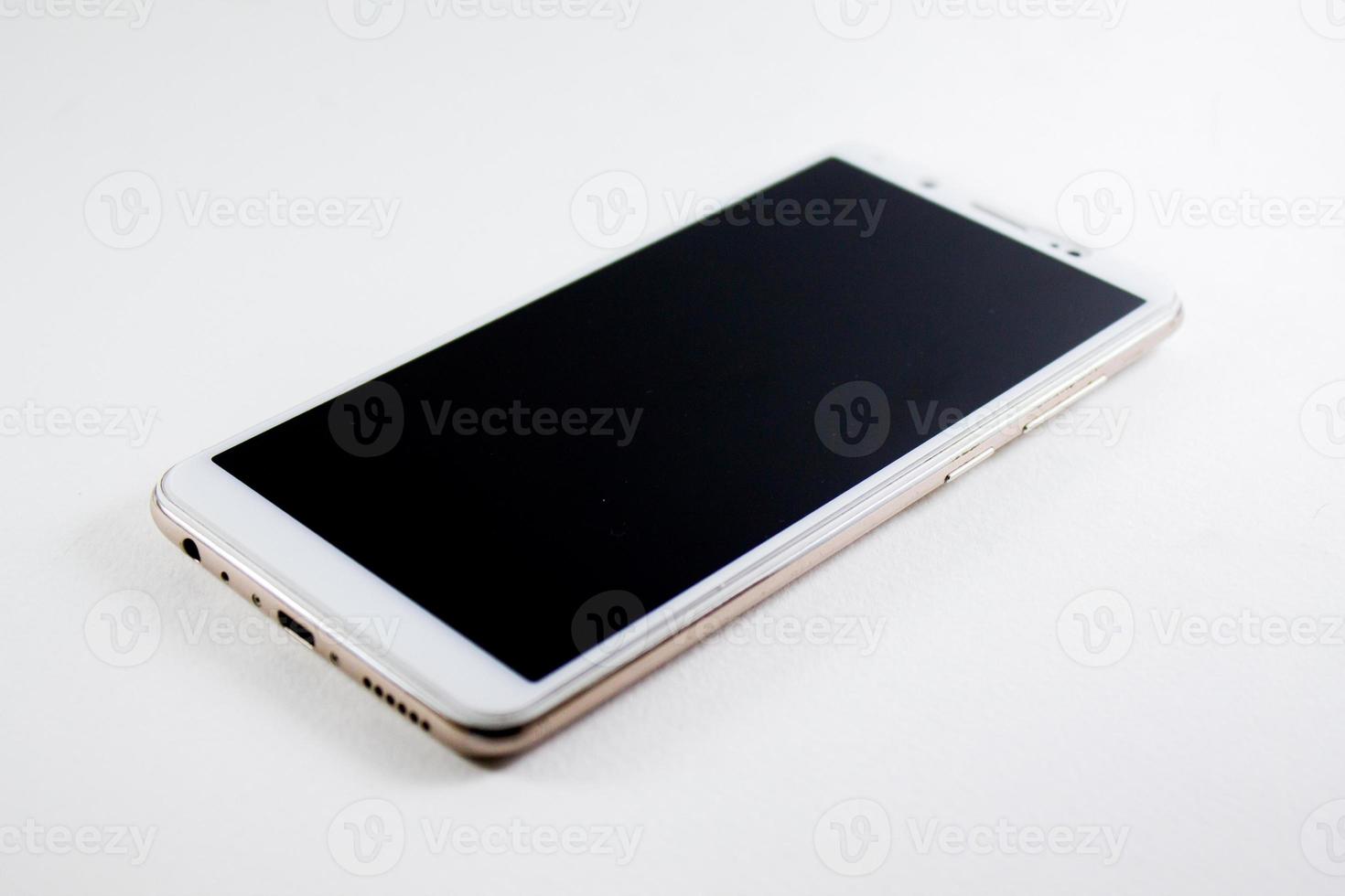 White mobile phone on a white background photo