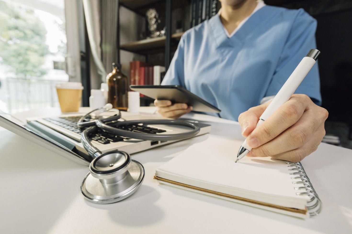 Medicine doctor and stethoscope touching icon medical network connection with modern interface on digital tablet in hospital background. Medical technology network concept photo