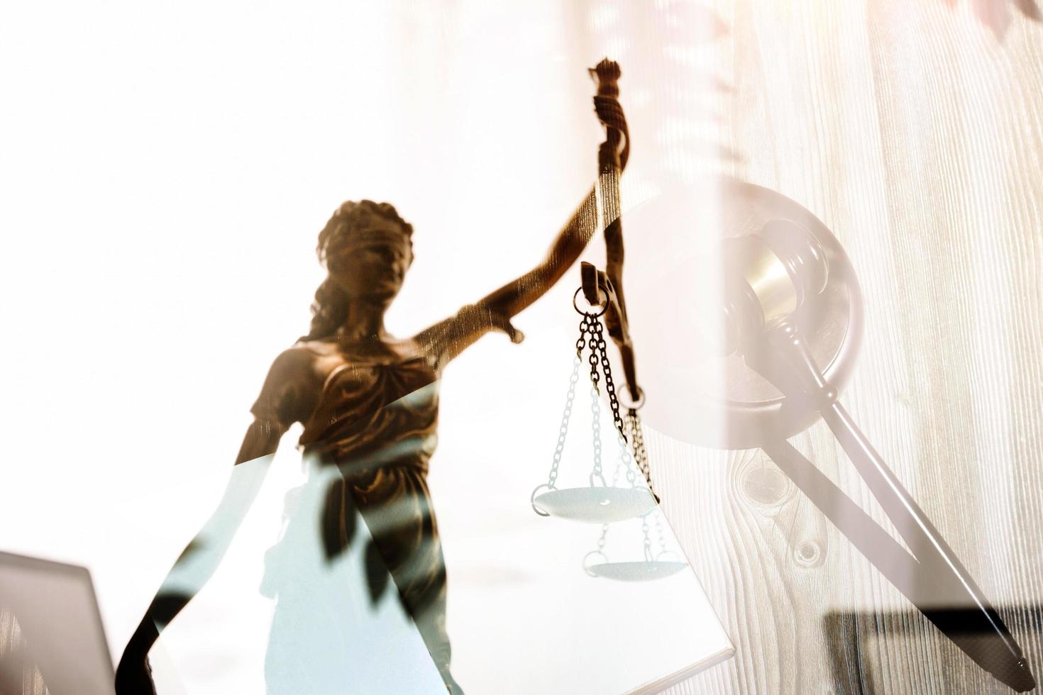 justice and law concept.Male judge in a courtroom on wooden table and Counselor or Male lawyer working in office. Legal law, advice and justice concept. photo