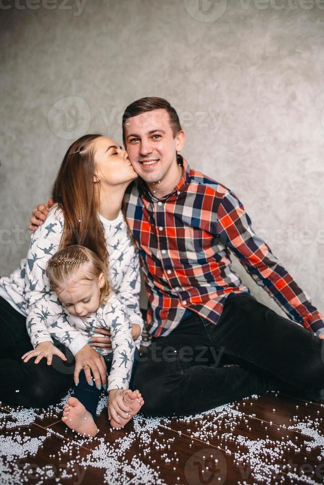 Happy family playing together on the floor photo