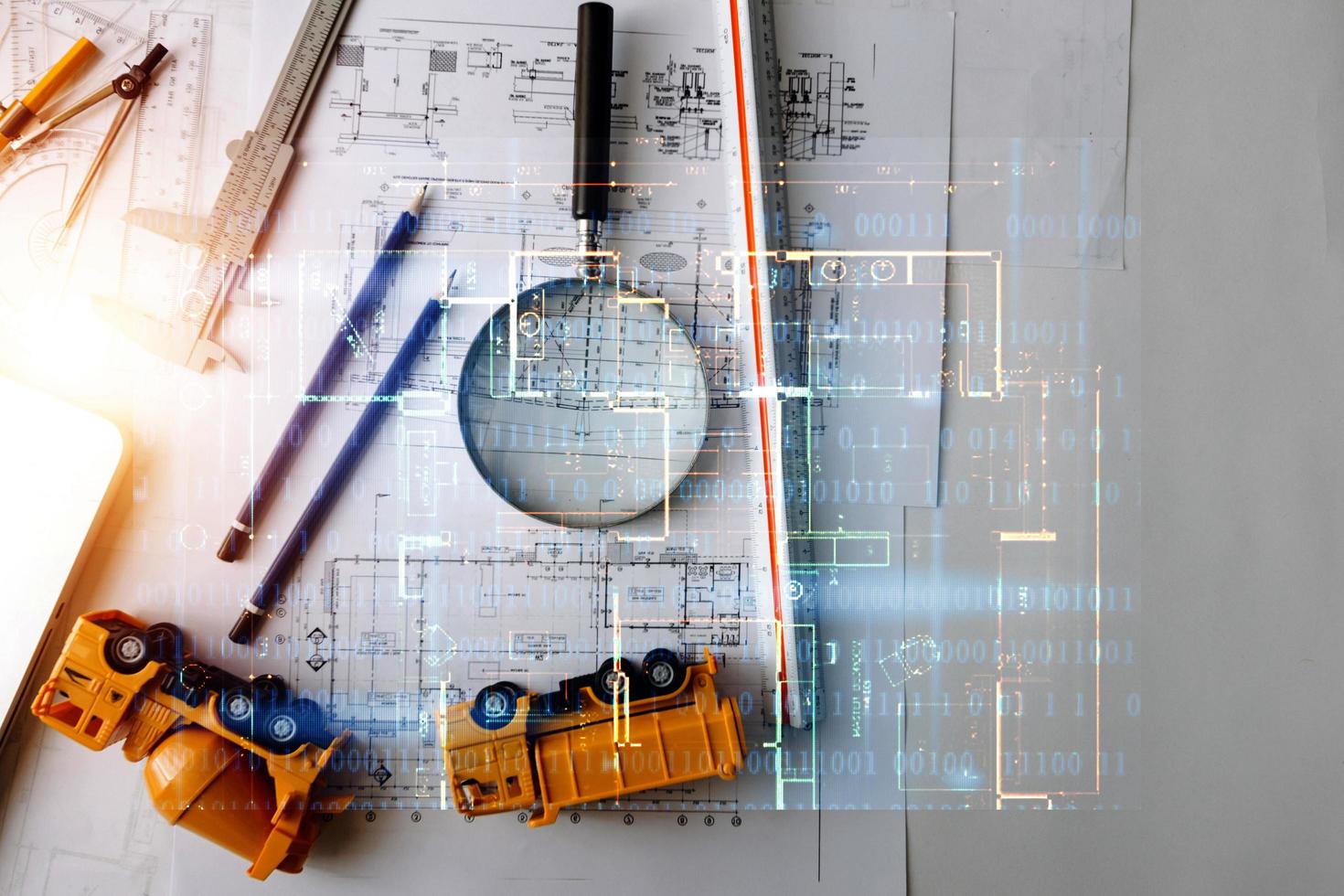 business hand working and laptop with on on architectural project at construction site at office desk in office photo