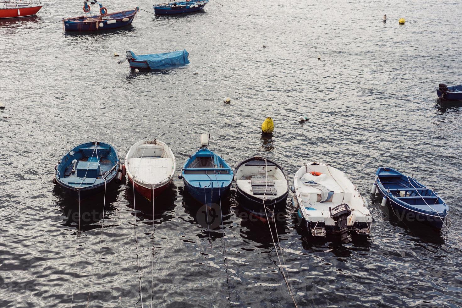 Berth with boats on sea shore photo