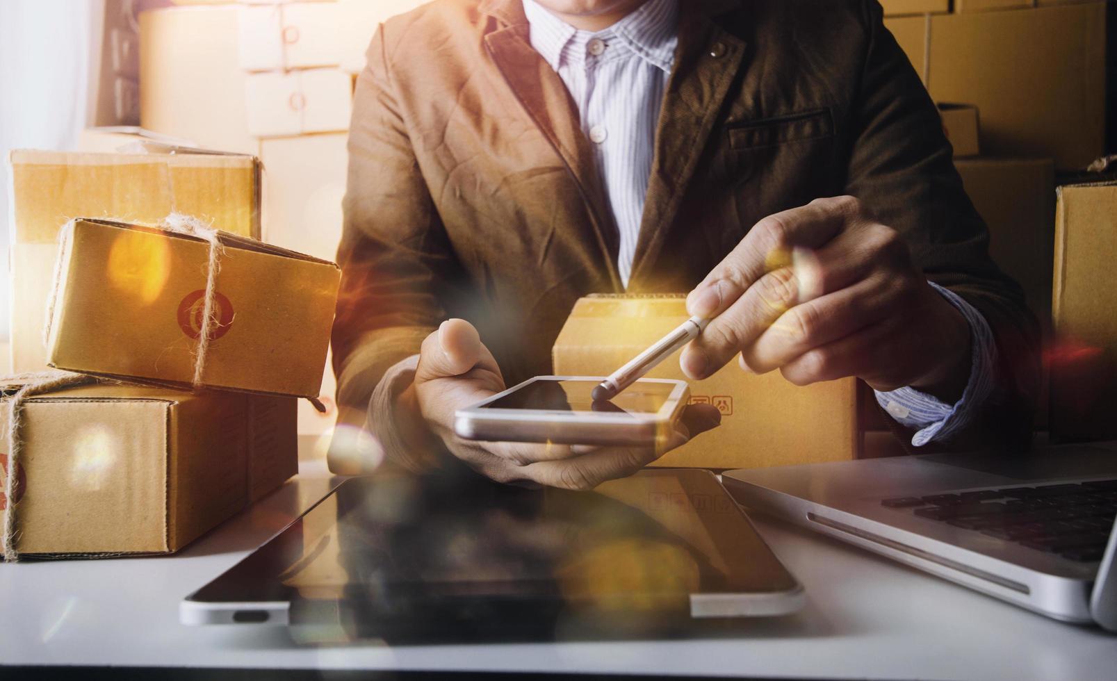 Online sales ideas for work at home. Asian man is answering phone calls. To accept orders from online customers.Very good sale. online Business and E-commerce.Online shop photo