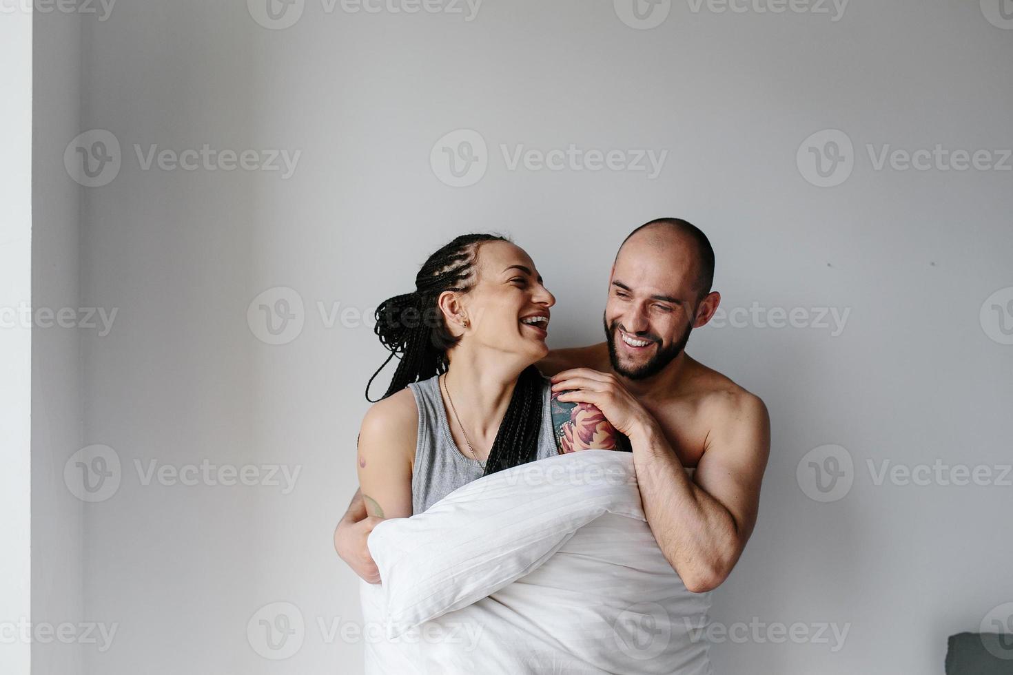 man and woman in the bedroom photo