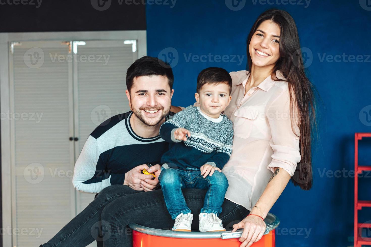 young family having fun at home photo