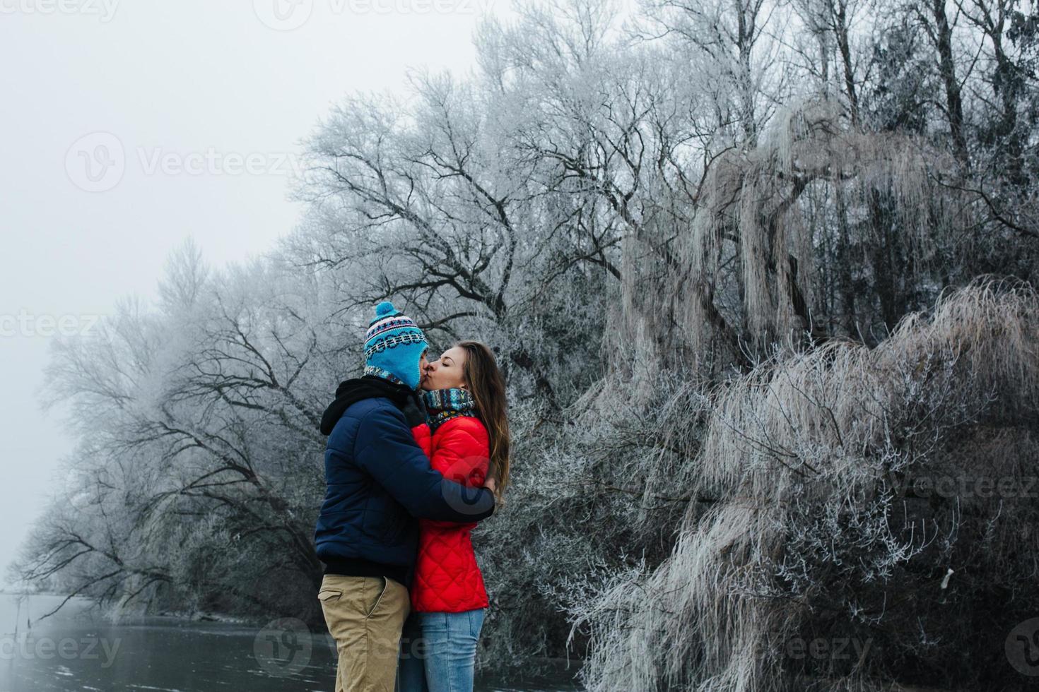 beautiful couple having fun on the pier photo