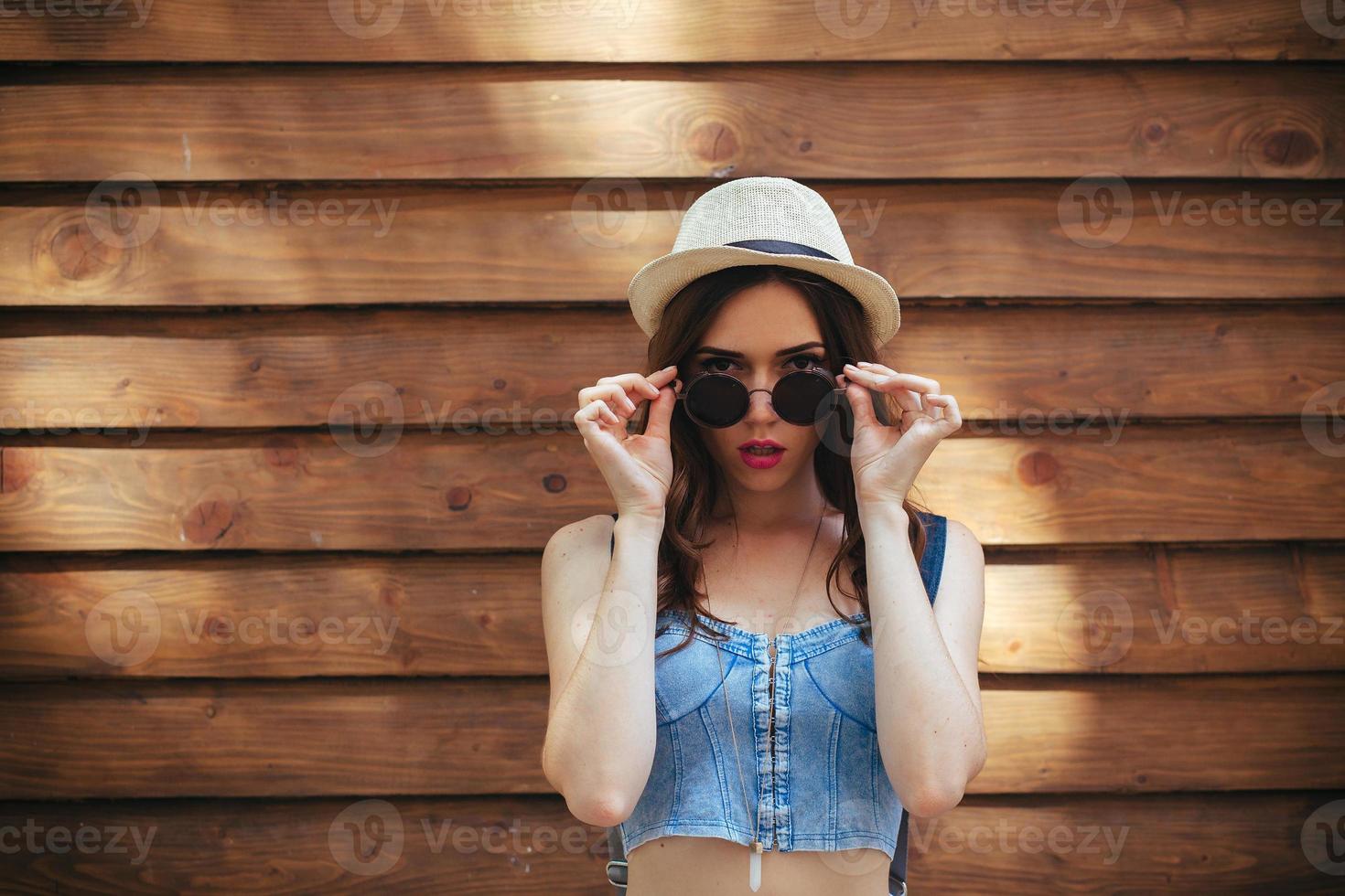 beautiful girl poses for camera in the city photo