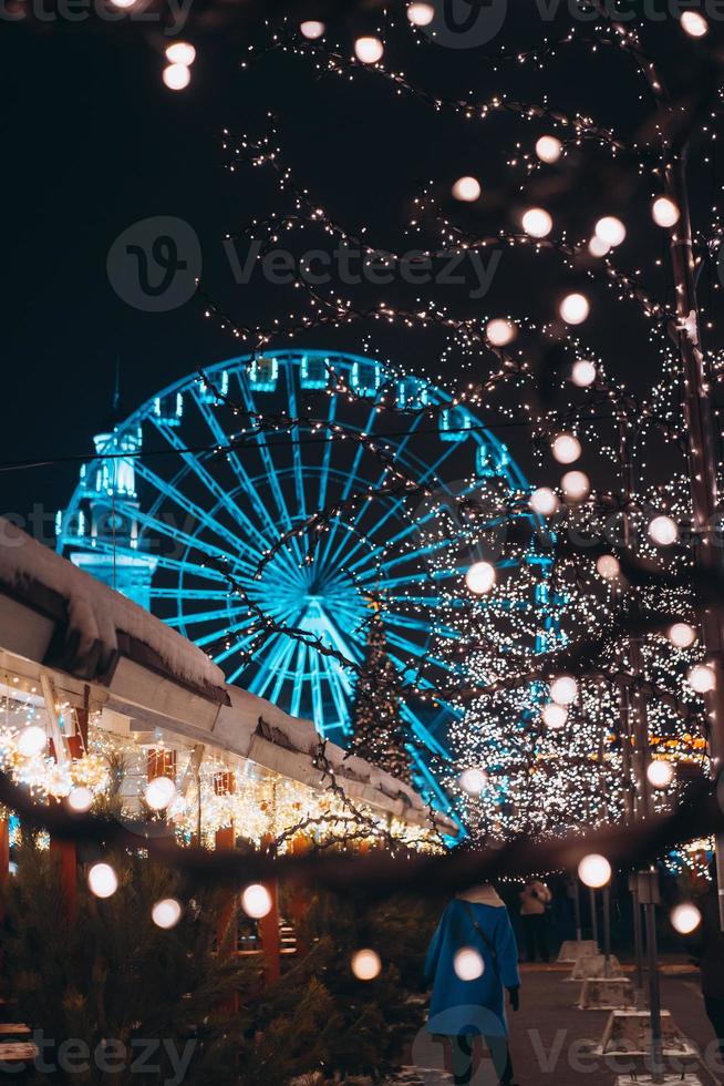 Christmas zone on Kontraktova Square with a Ferris wheel photo