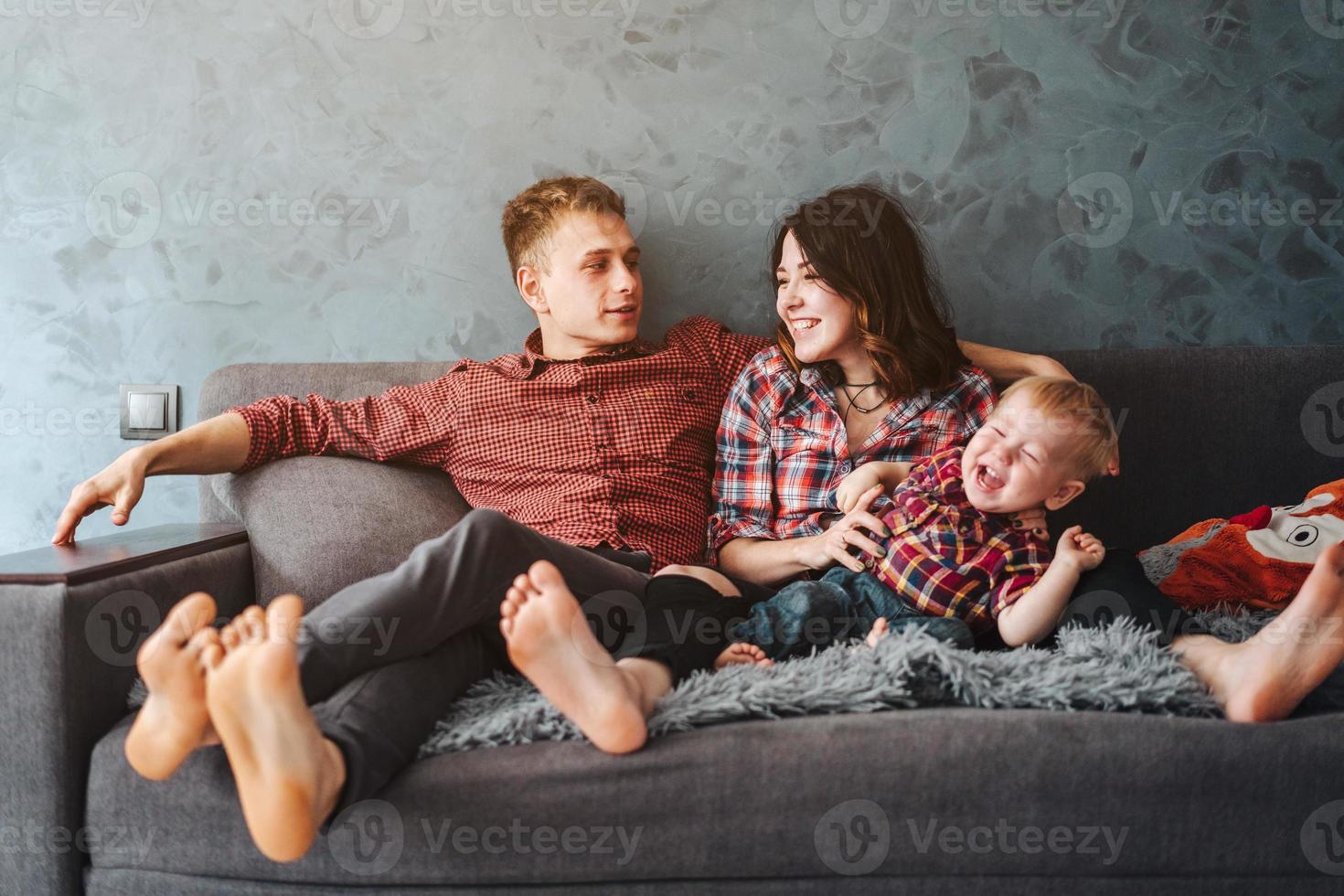 Happy family on the couch photo