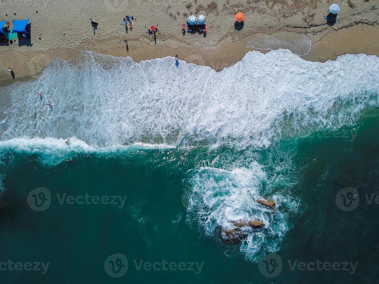 Beach with sun loungers on the coast of the ocean photo