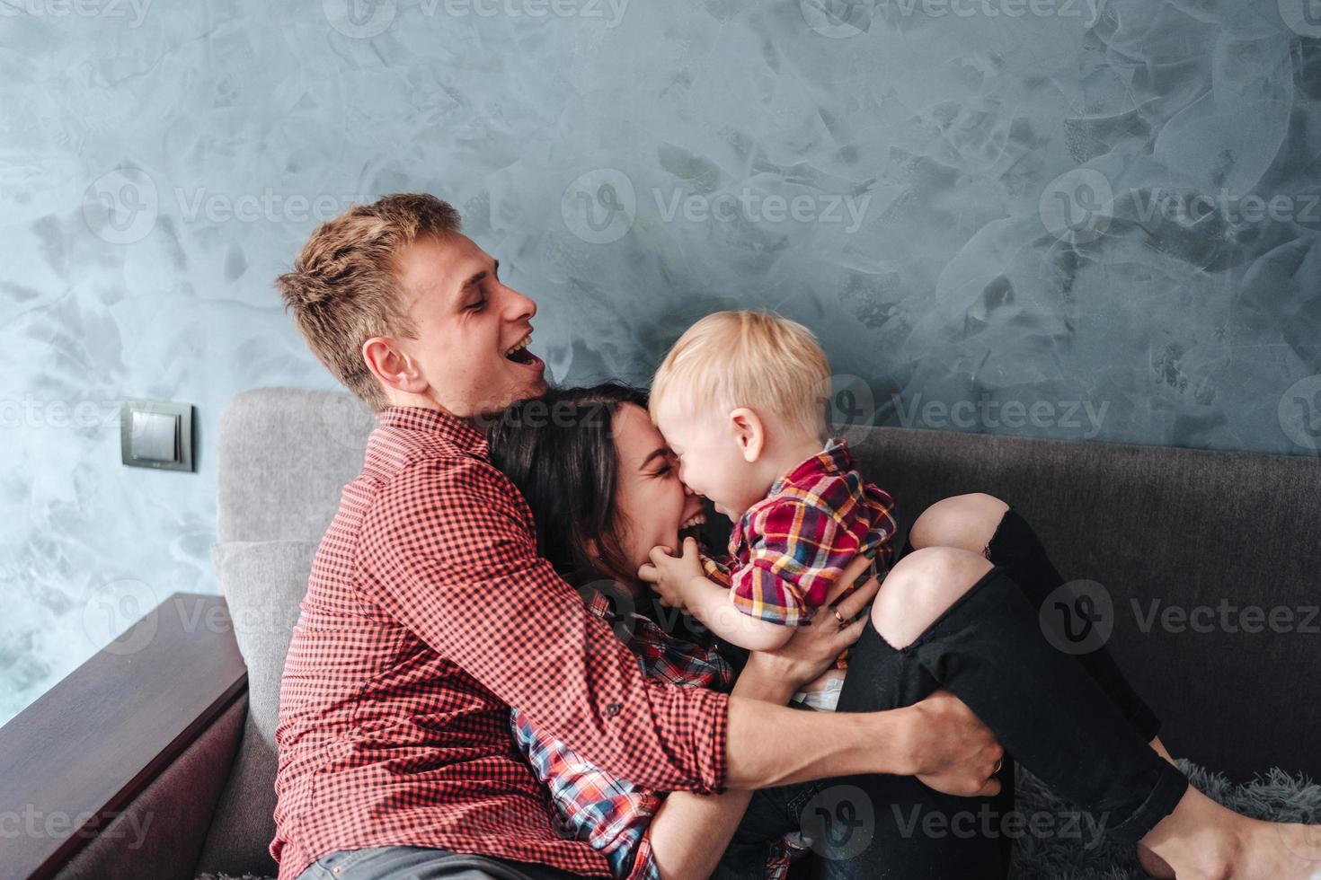 Happy family on the couch photo