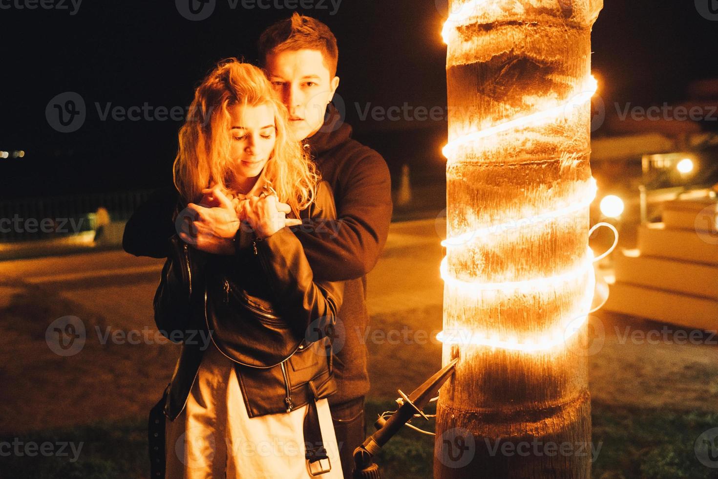 Young couple embracing outdoor photo