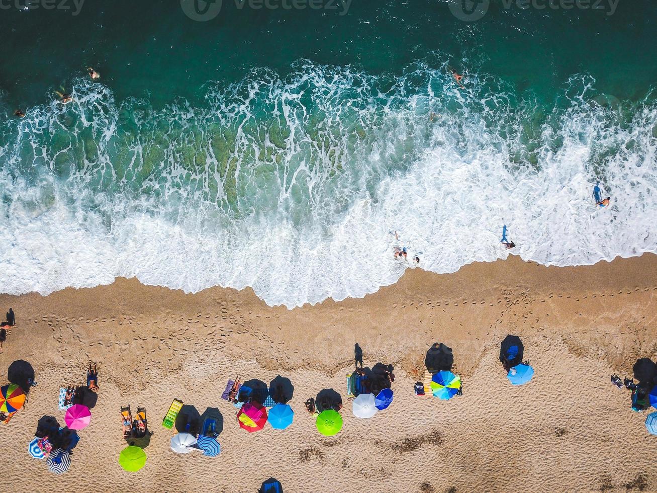 Beach with sun loungers on the coast of the ocean photo