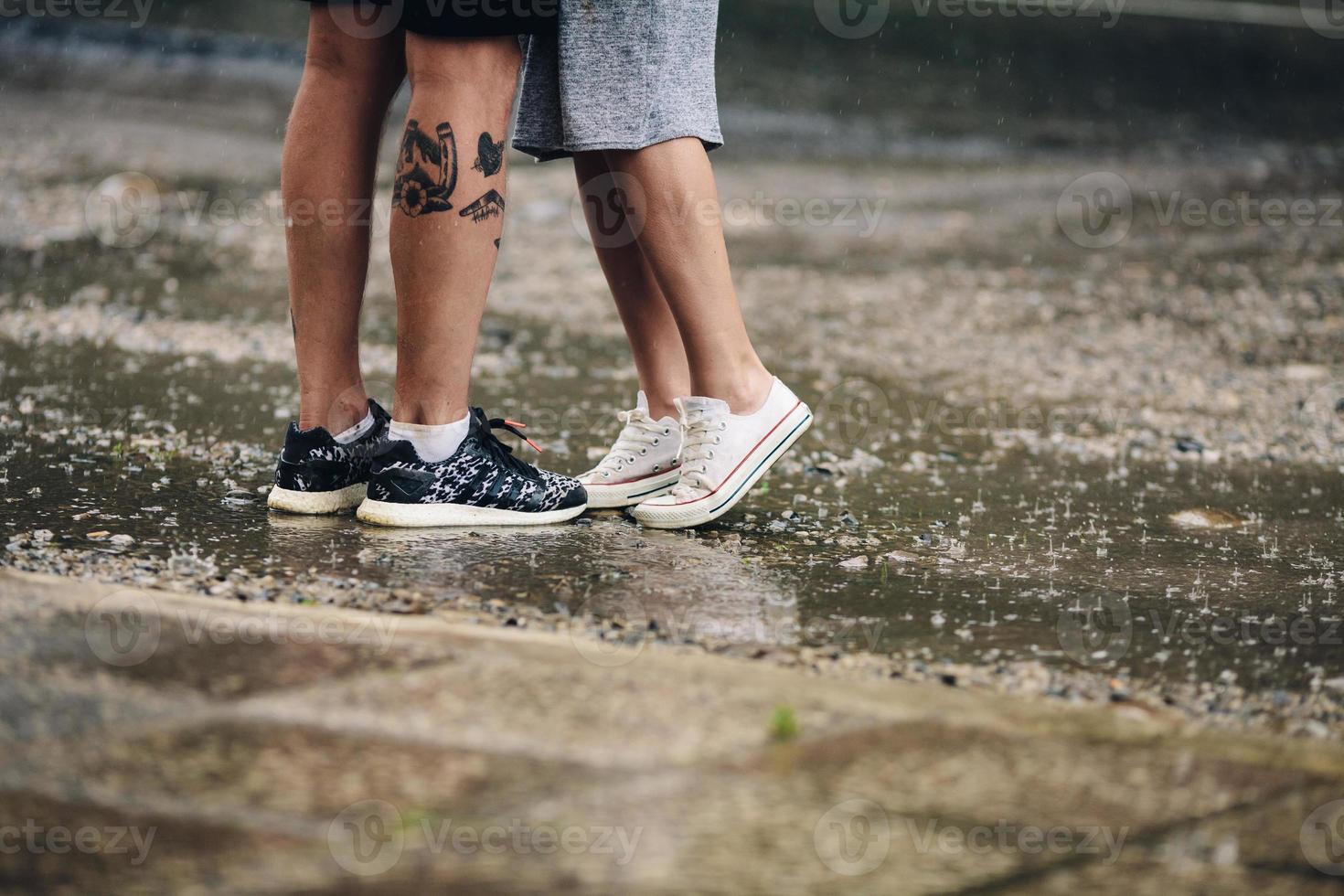 couple on the background of wet asphalt photo