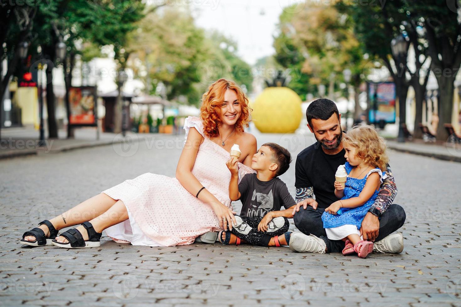 beautiful young family with ice cream photo