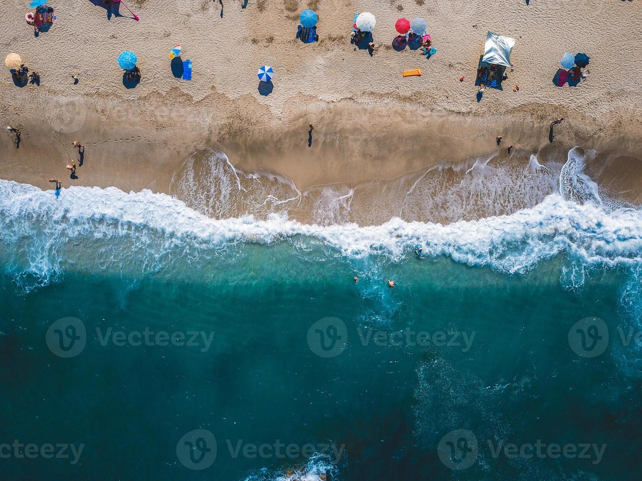 Beach with sun loungers on the coast of the ocean photo